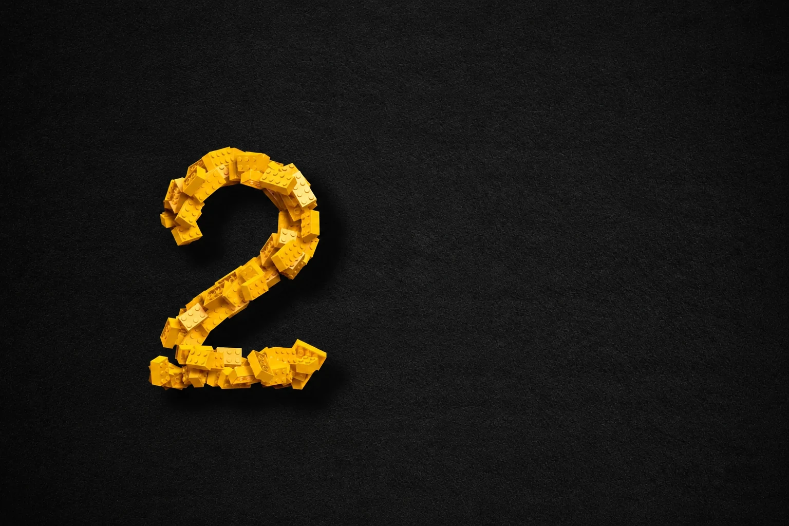 A number two built from yellow construction bricks
